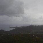 Vista de Cala Tarida con nubes y lluvia durante la DANA Alice en Ibiza