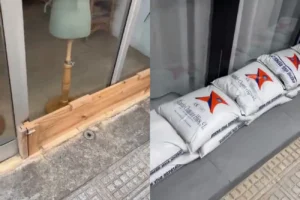 Sacos de arena y barreras en un comercio de Ibiza ante la tormenta.